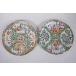 A pair of C19th Canton famille rose porcelain cabinet plates, decorated with figures conversing,