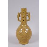 A Chinese yellow ground Ge ware bottle vase with two handles, impressed mark to base, 22cm high