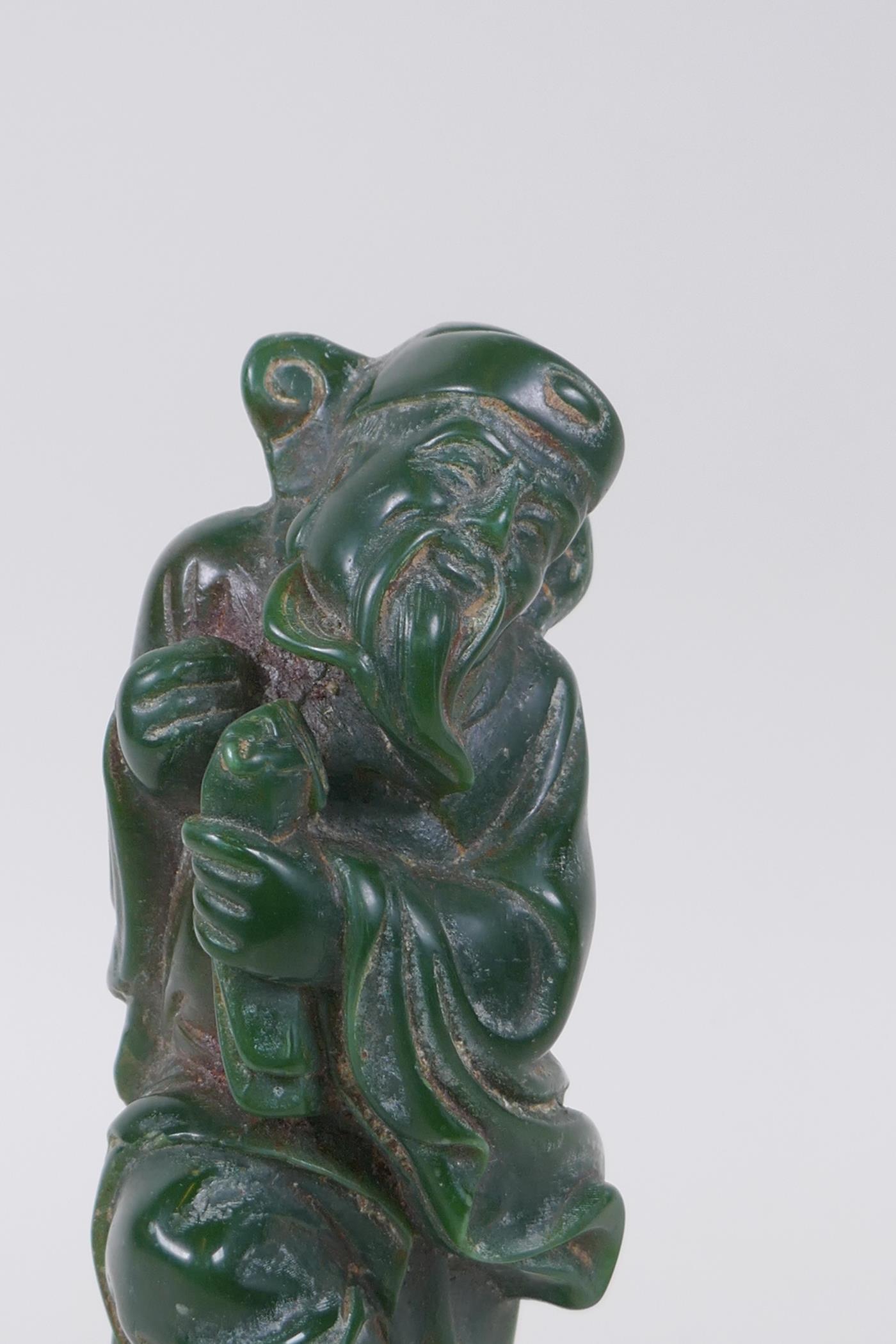 A Chinese green hardstone figure of an immortal, 19cm high - Image 2 of 4