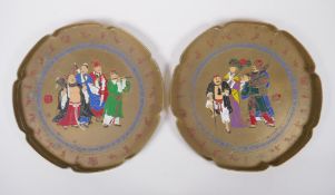 A pair of Chinese brass trays of lobed form with enamel decoration depicting the eight immortals,