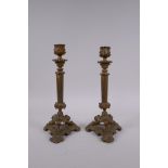 A pair of Victorian gilt bronzed metal candlesticks