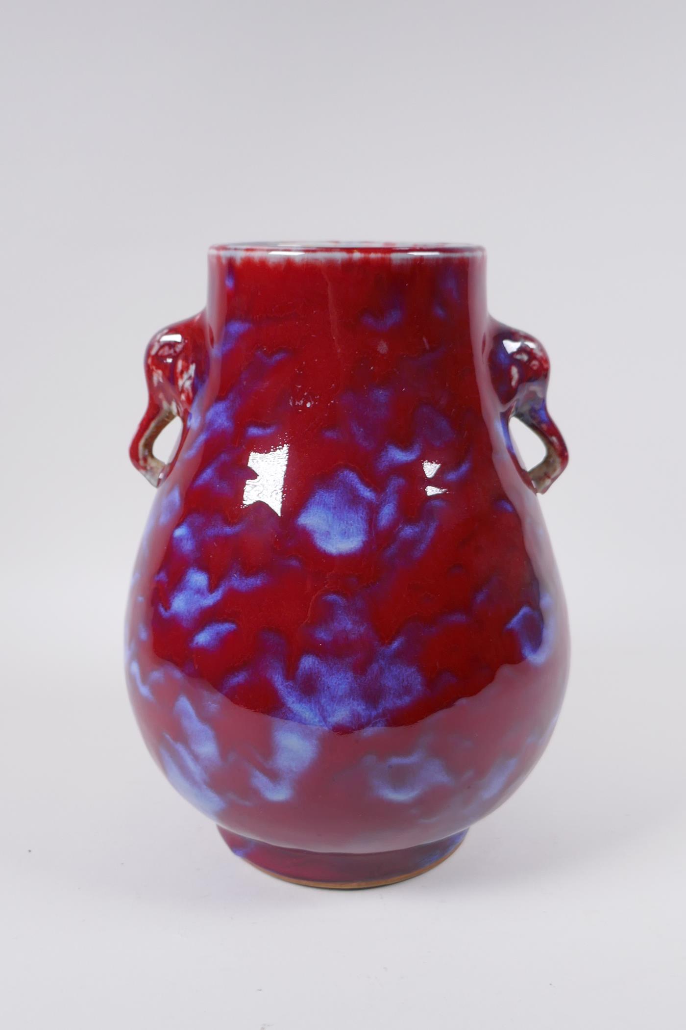 A Chinese flambe glazed porcelain vase with two elephant mask handles, 26 cm high - Image 3 of 5