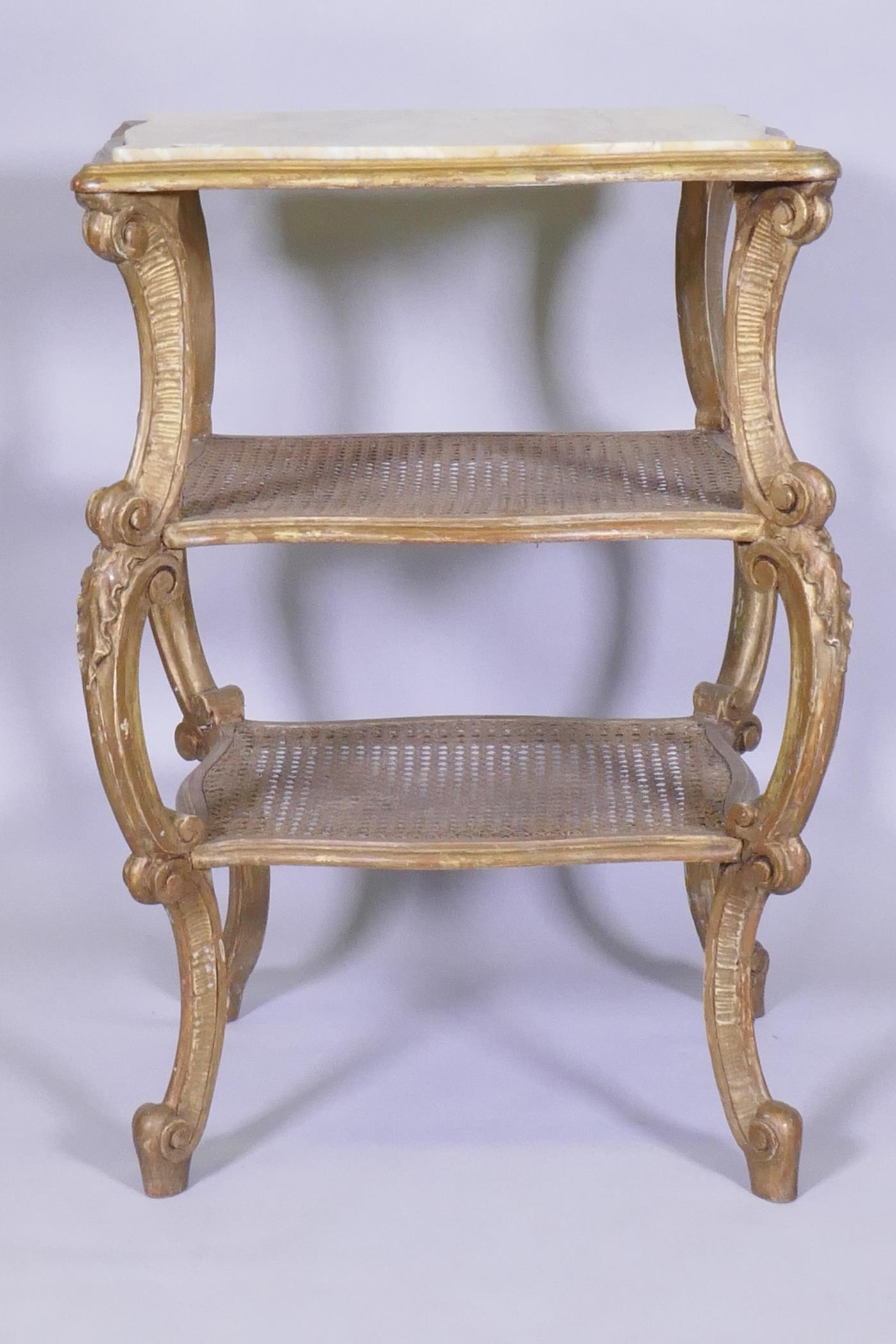 A C19th Italian giltwood three tier serpentine shaped etagere, with inset marble top and caned - Image 3 of 3