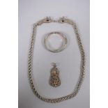 A Chinese white metal chain link necklace with twin dragon head clasp, a similar pendant and a