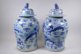 A pair of Chinese blue and white porcelain Meiping jars and covers with kylin decoration and fo