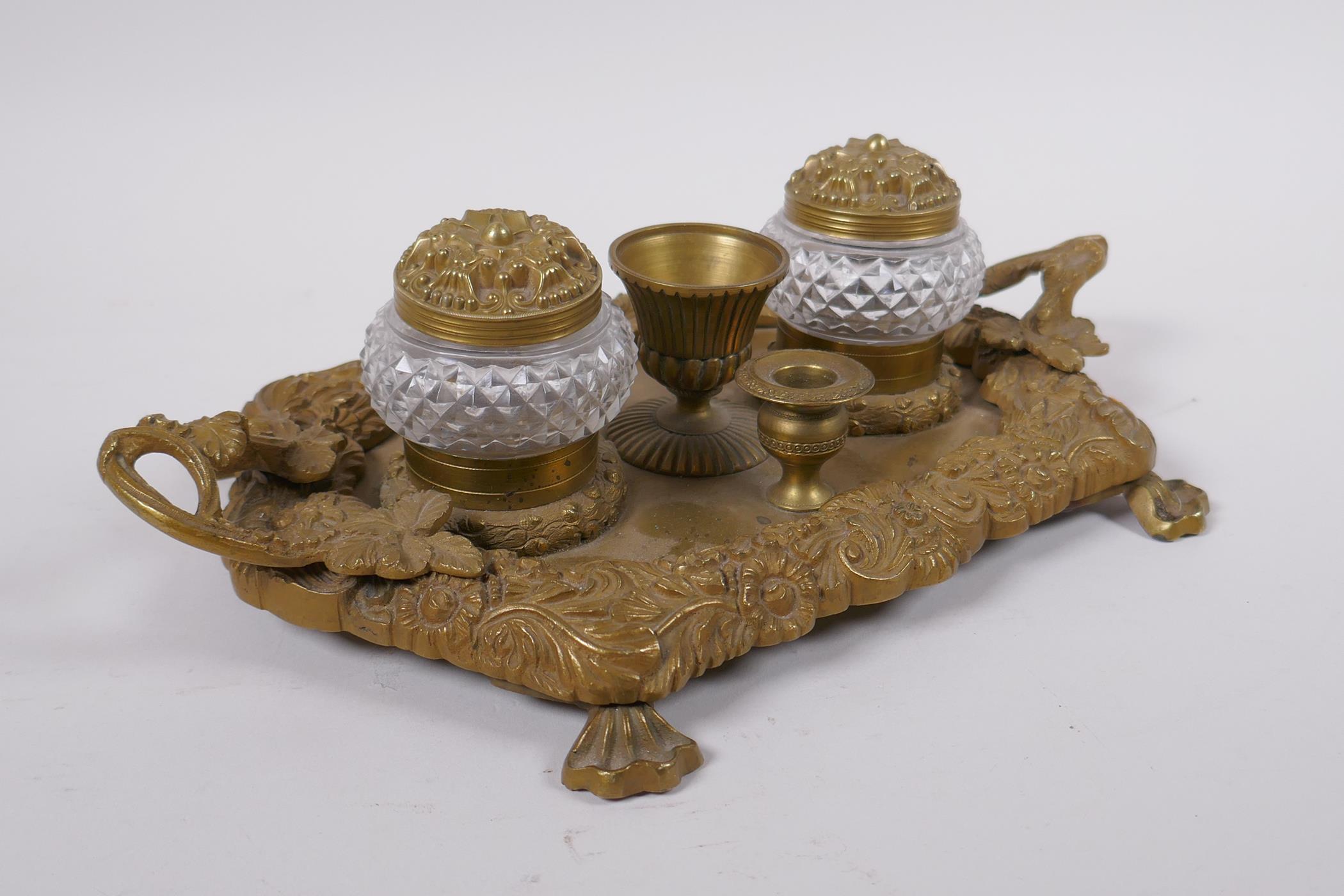 An antique brass desk stand with raised vine decoration and two glass inkwells, 30 x 20cm - Image 3 of 3