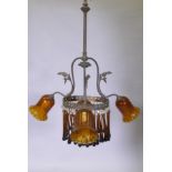 An early C19th continental pendant ceiling light with three branches and amber glass drops and