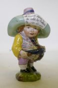 A porcelain Mansion House dwarf, wearing a hat inscribed A Small Farm to be Sold by Auction by Mr.