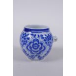 A blue and white porcelain bird feeder with scrolling floral decoration, Chinese KangXi 4