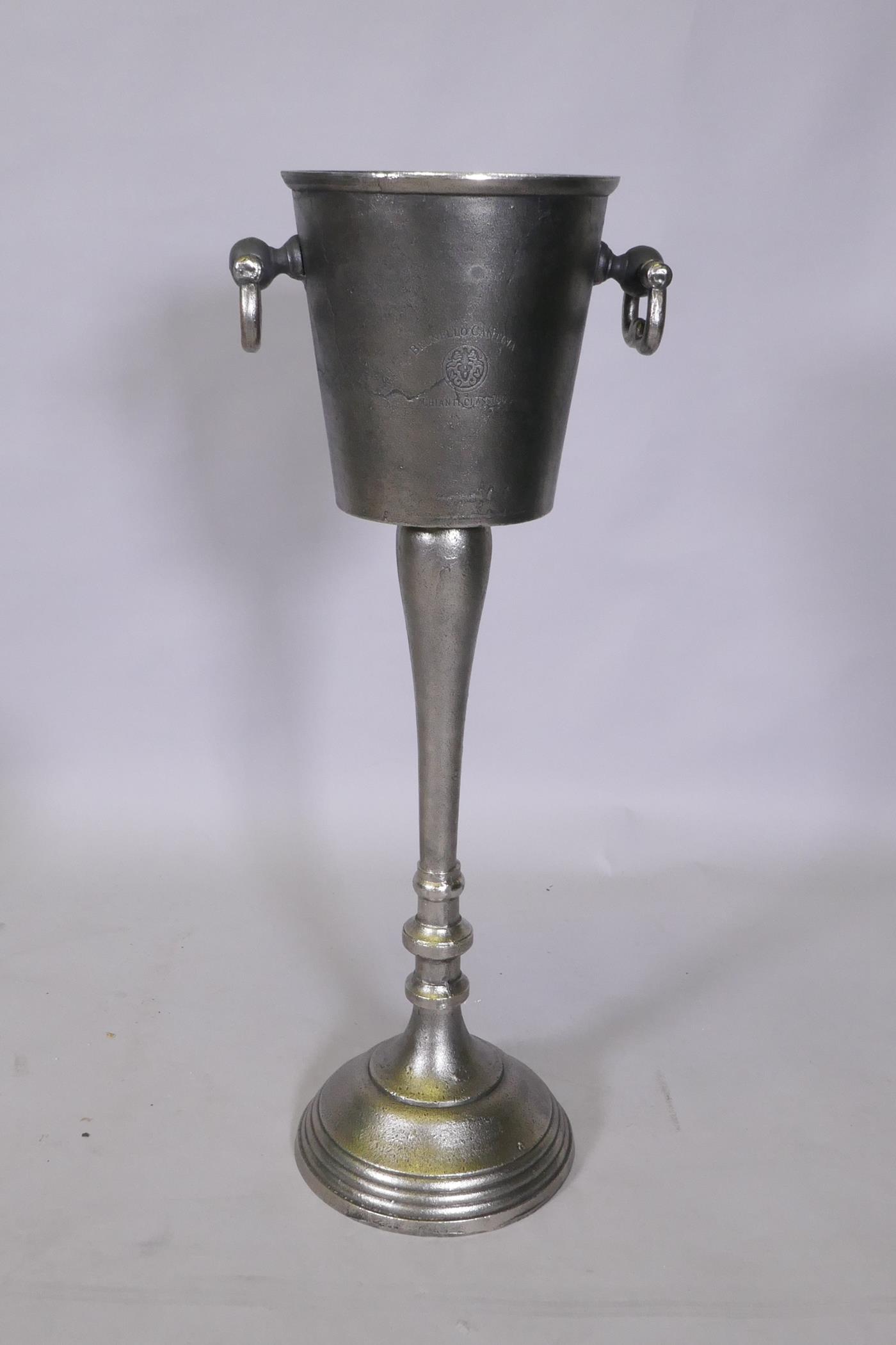 A cast metal Champagne bucket on stand, 74cm high