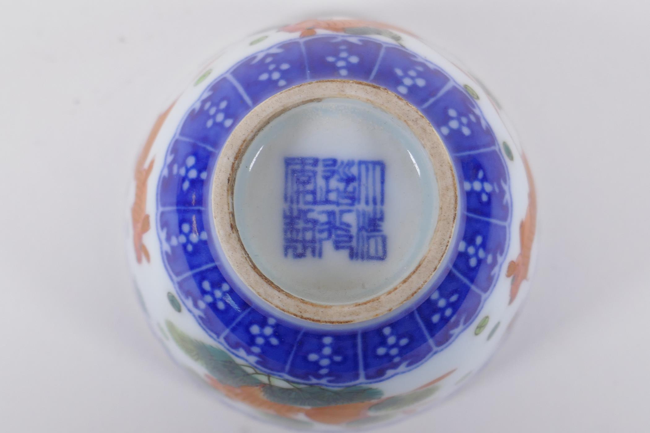 A blue and white porcelain tea bowl with iron red goldfish decoration, Chinese Dao Guang seal mark - Image 5 of 5