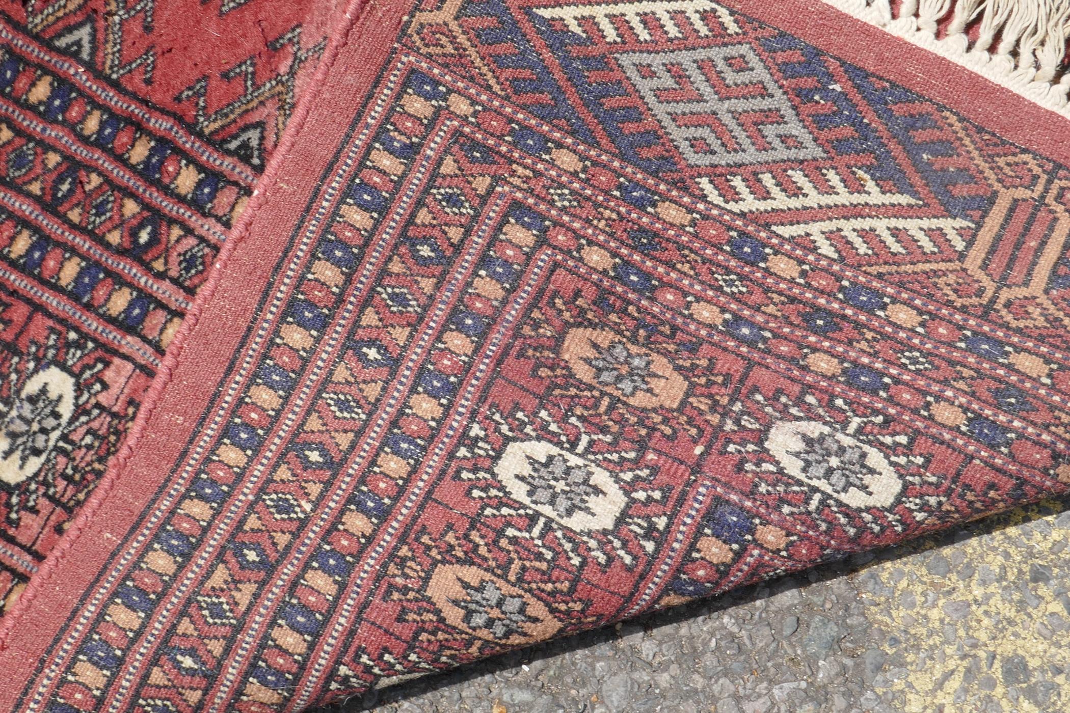 A Turkish terracotta ground wool rug with all over geometric design, 98 x 154cm - Image 4 of 7
