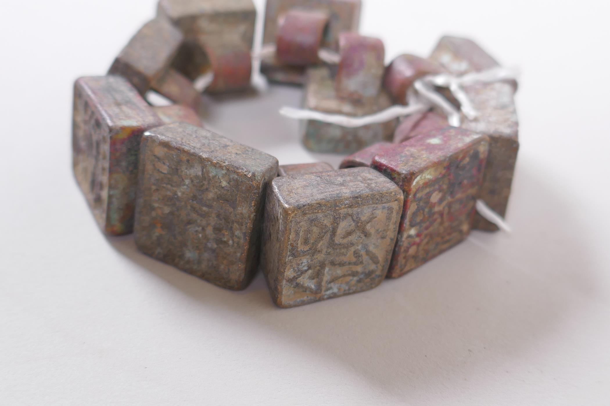 Ten archaic style Chinese bronze seals, 2 x 2cm - Image 4 of 5