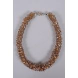 A champagne coloured pearl and glass choker, 44cm long