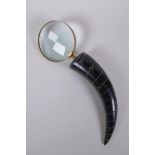 A horn handled brass mounted magnifying glass, 32cm long