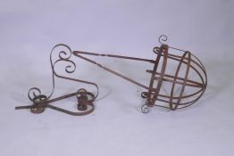 A wrought metal hanging flower basket, 33cm internal diameter, 110cm high