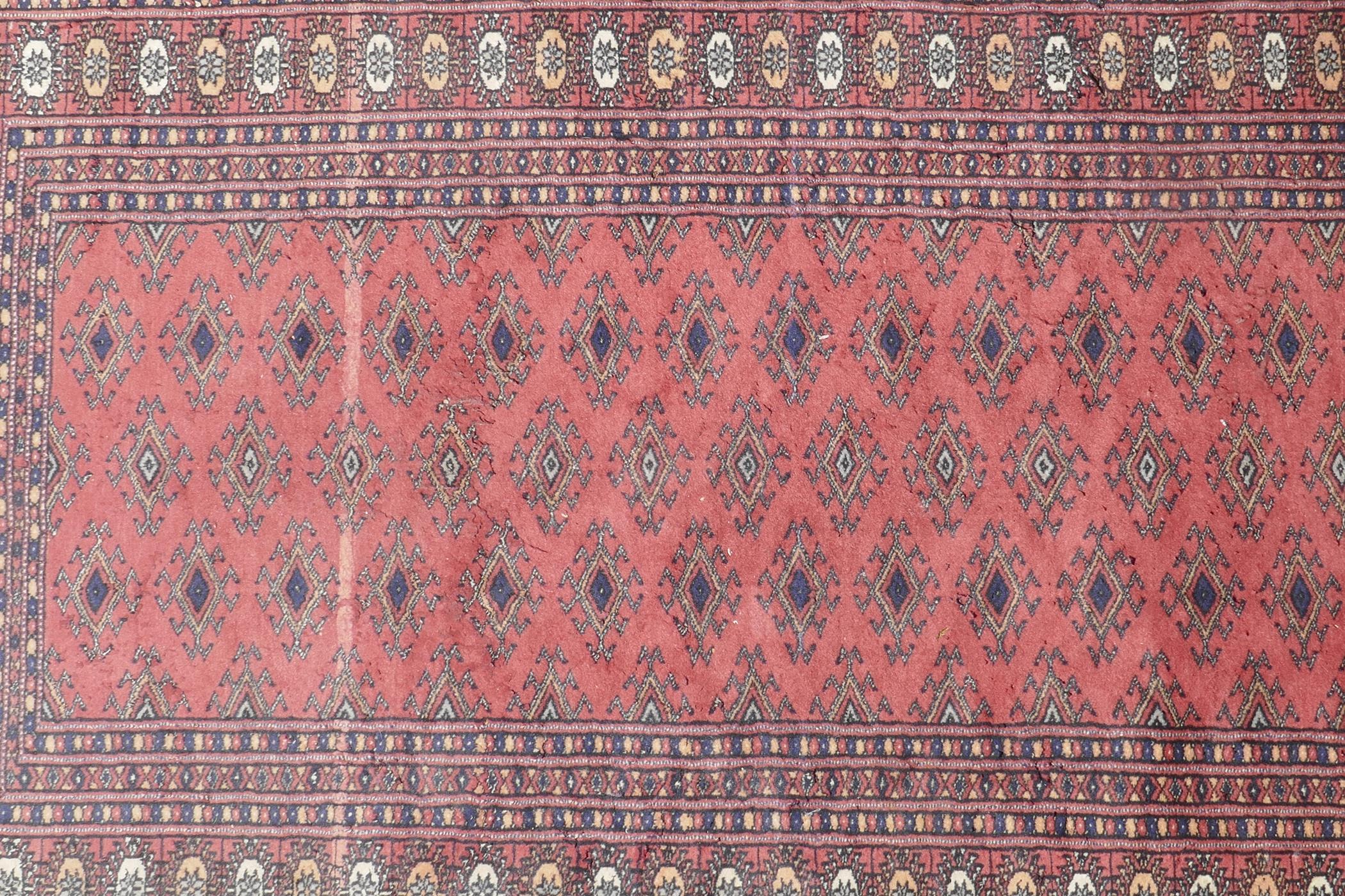 A Turkish terracotta ground wool rug with all over geometric design, 98 x 154cm - Image 2 of 7