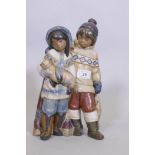 A rare Lladro figure group, Arctic Allies, No 12227, of two Eskimo children with a seal pup, stamp
