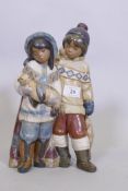 A rare Lladro figure group, Arctic Allies, No 12227, of two Eskimo children with a seal pup, stamp