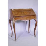 A C19th continental marquetry inlaid tulipwood and rosewood bonheure de jour, with pierced brass