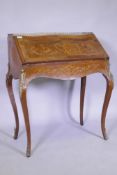 A C19th continental marquetry inlaid tulipwood and rosewood bonheure de jour, with pierced brass