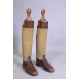 A pair of WWI officer's leather and canvas trench boots with wood lasts, sole length 30cm