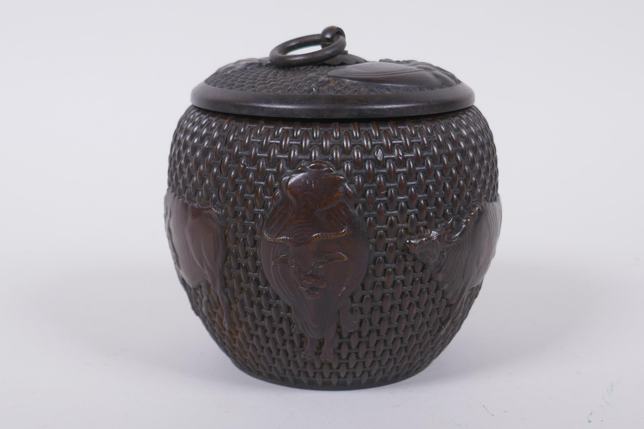 A Chinese bronze jar and cover of basket form, with water buffalo decoration, impressed Xuande 4