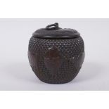 A Chinese bronze jar and cover of basket form, with water buffalo decoration, impressed Xuande 4