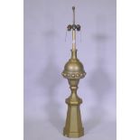 A brass lamp in the form of an architectural finial, 119cm high