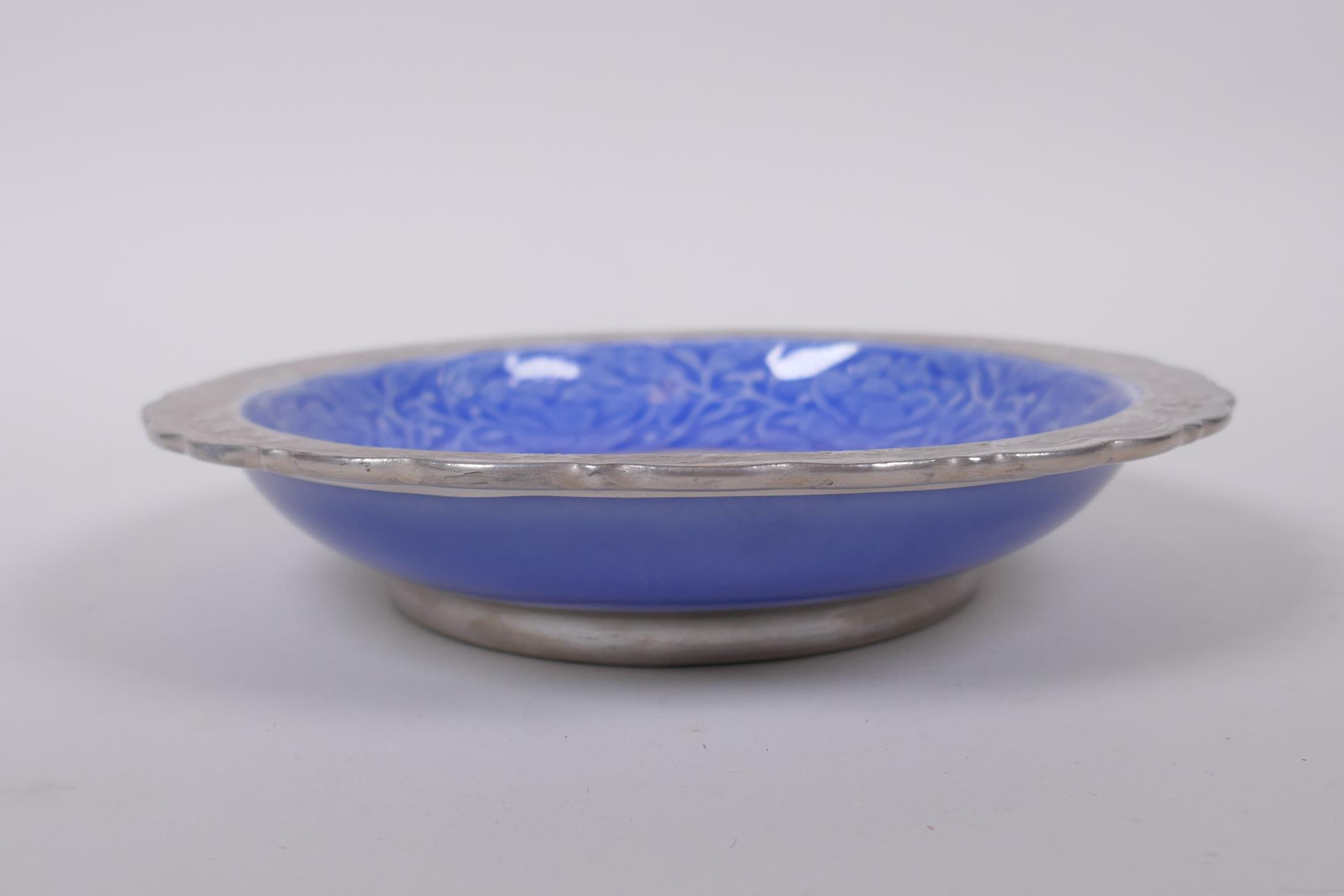 A Chinese blue and silver glazed porcelain dish with lobed rim, decorated with a dragon, phoenix and - Image 3 of 5