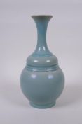 A Chinese Ru ware style porcelain vase with slender neck, 26cm high