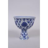 A blue and white porcelain stem cup with lotus flower decoration, Chinese Xuande 6 character mark to