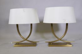 A pair of R.V. Astley 'Iva' table lamps in antiqued brass finish, 59cm high with shade