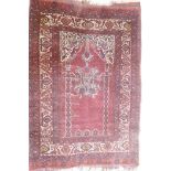 An antique Persian prayer rug, with lantern design, on a red field, 95 x 137cm