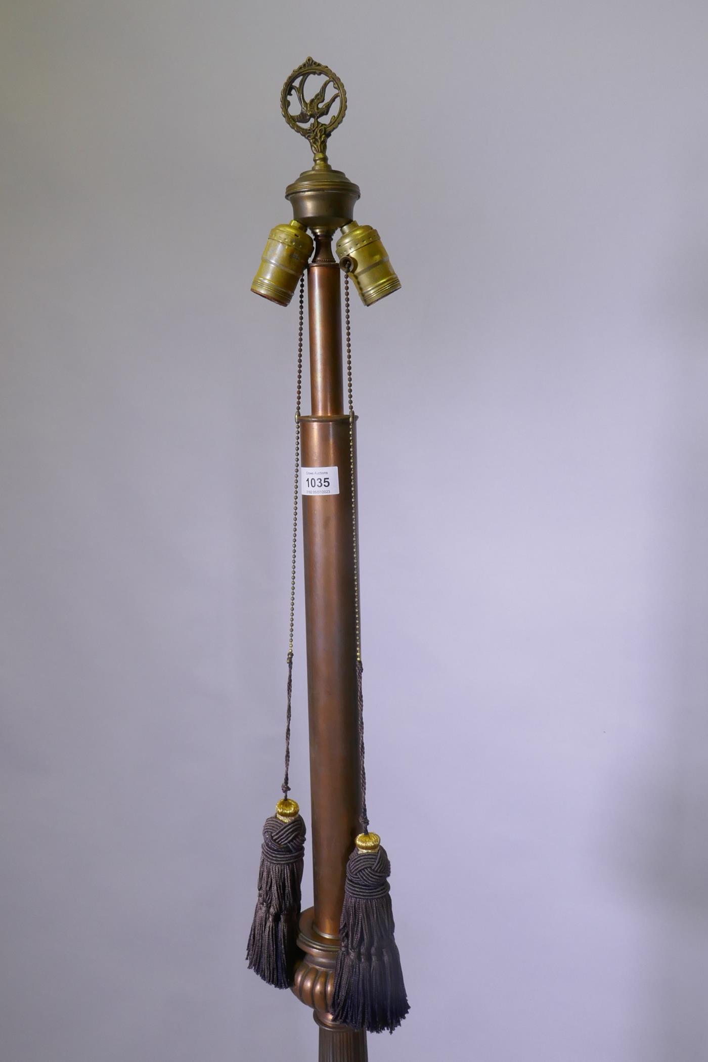 A copper and bronzed metal floor lamp with fluted column and Renaissance Revival style decoration, - Image 3 of 4