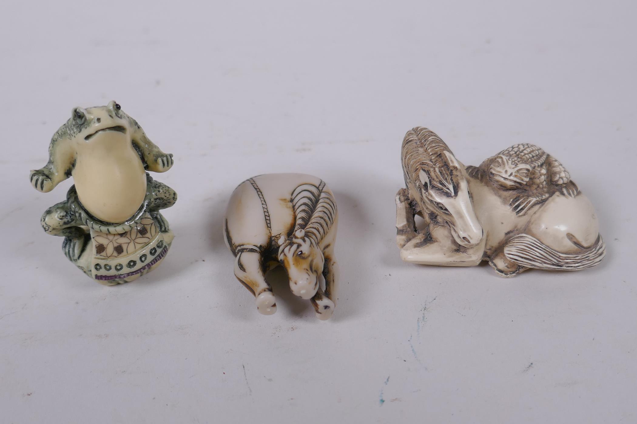 Three Japanese composition netsuke in the form of horses and toads, 5cm
