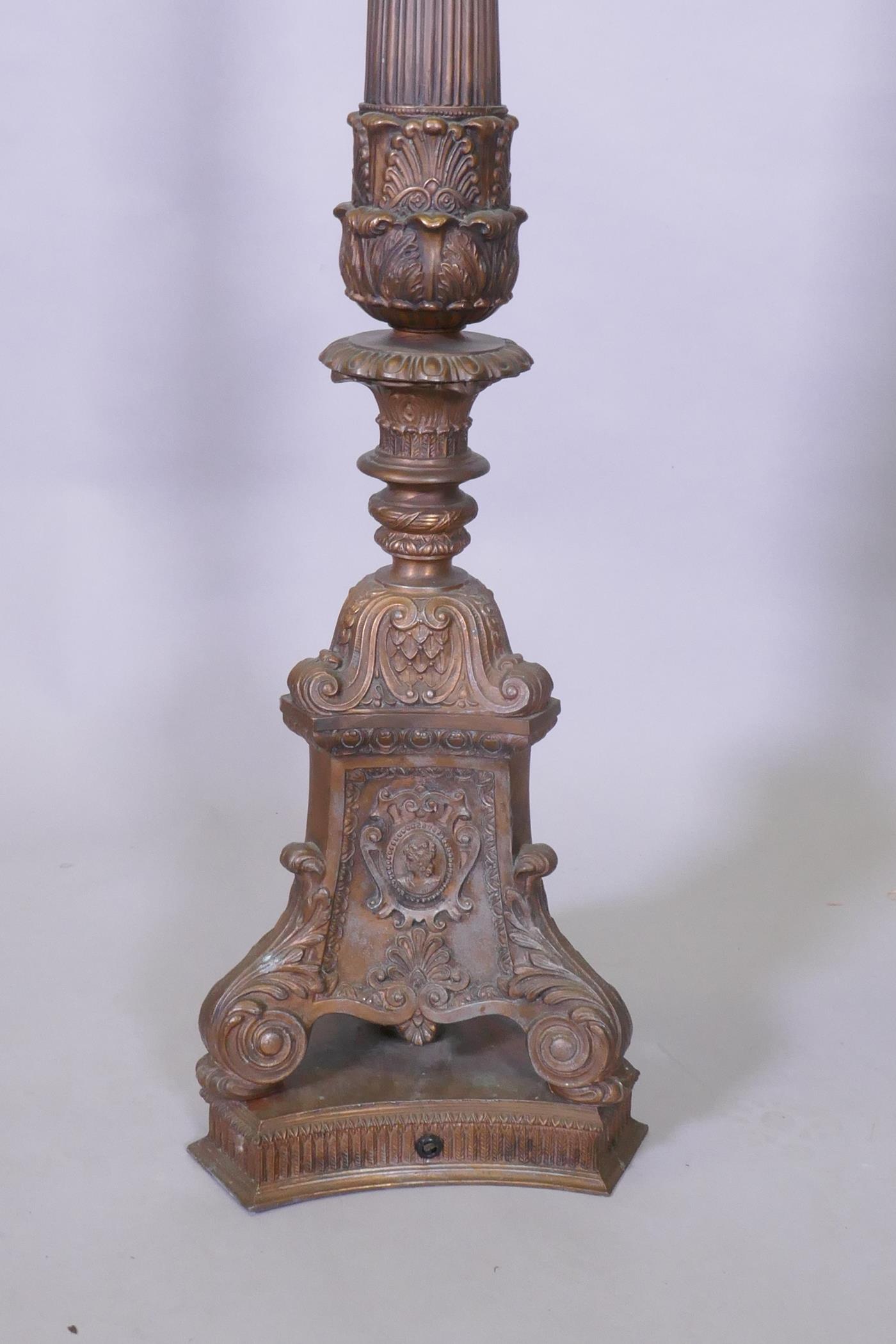 A copper and bronzed metal floor lamp with fluted column and Renaissance Revival style decoration, - Image 2 of 4