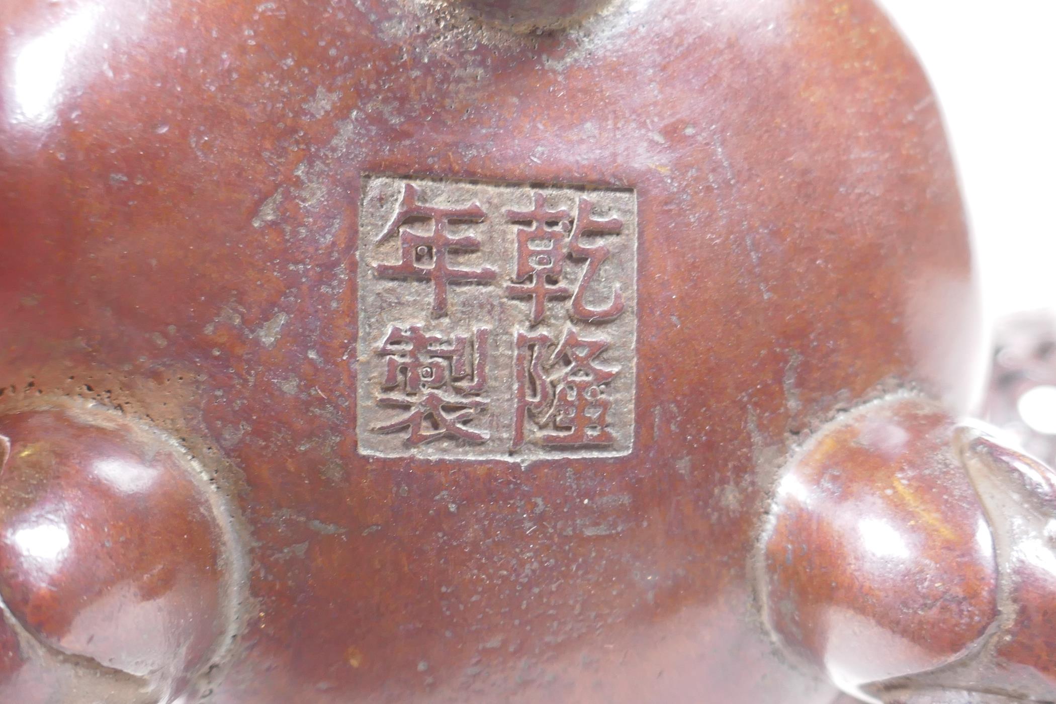 A Chinese bronze censer and pierced cover with tripod supports and scrolling floral decoration, 4 - Image 5 of 5