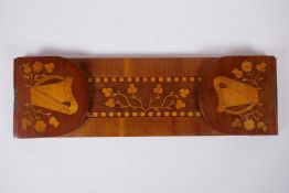 A C19th Irish Kilarney satinwood inlaid yew wood book slide, decorated with harps and clover