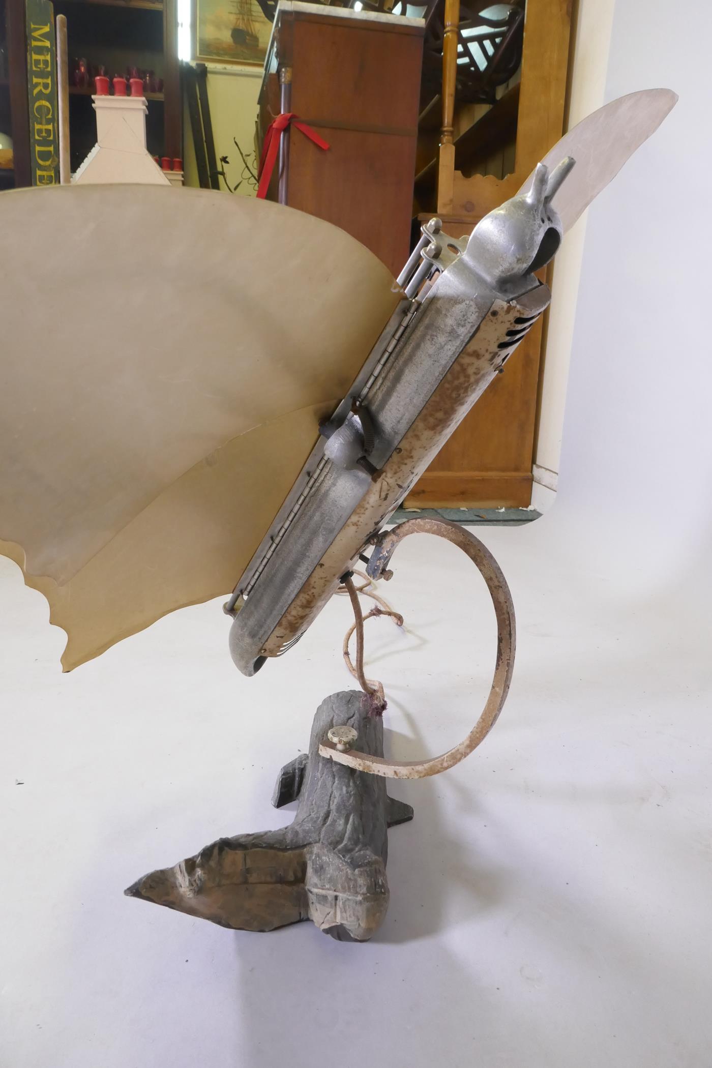 An Art Deco butterfly room heater, on an aluminium swivel arm, on a naturalistic log base, 77cm high - Image 3 of 3