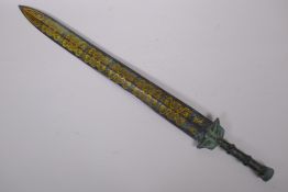 A Chinese archaic style bronze short sword with stylised gilt etched dragon decoration, 61cm long