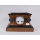 A C19th burr walnut mantel clock with ebonised mouldings and bronzed mounts, the enamel dial with