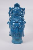 A Chinese teal glazed ceramic Quan Yin head bust, incised character inscription to base, 36cm high