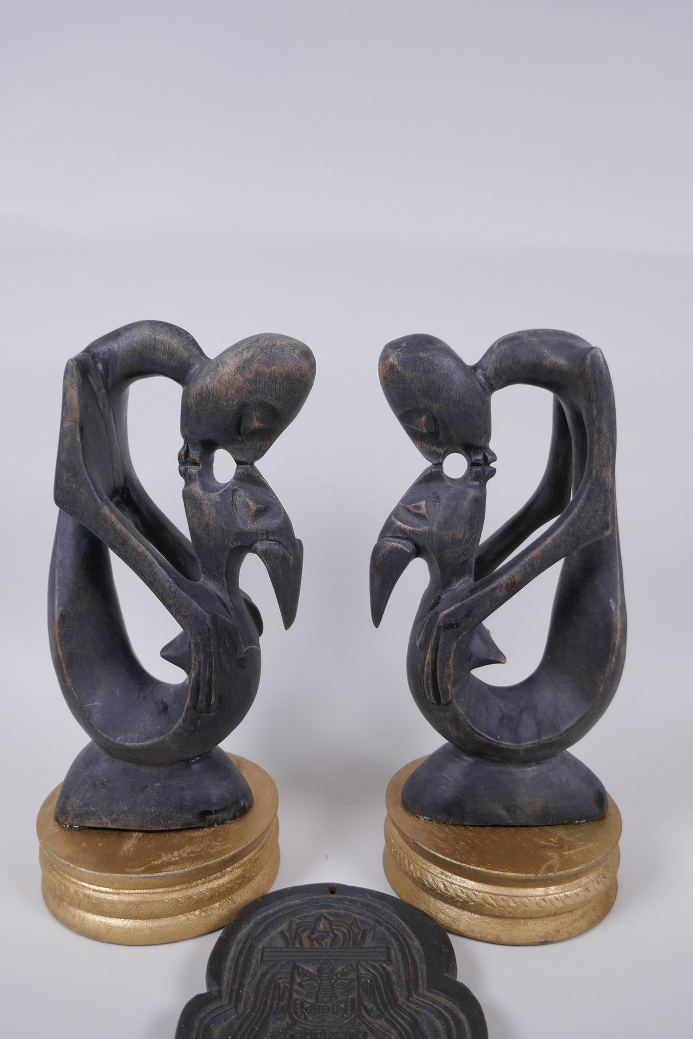 A pair of African carved hardwood figure groups, and a Tibetan carved wood plaque, largest 28cm high - Image 2 of 5
