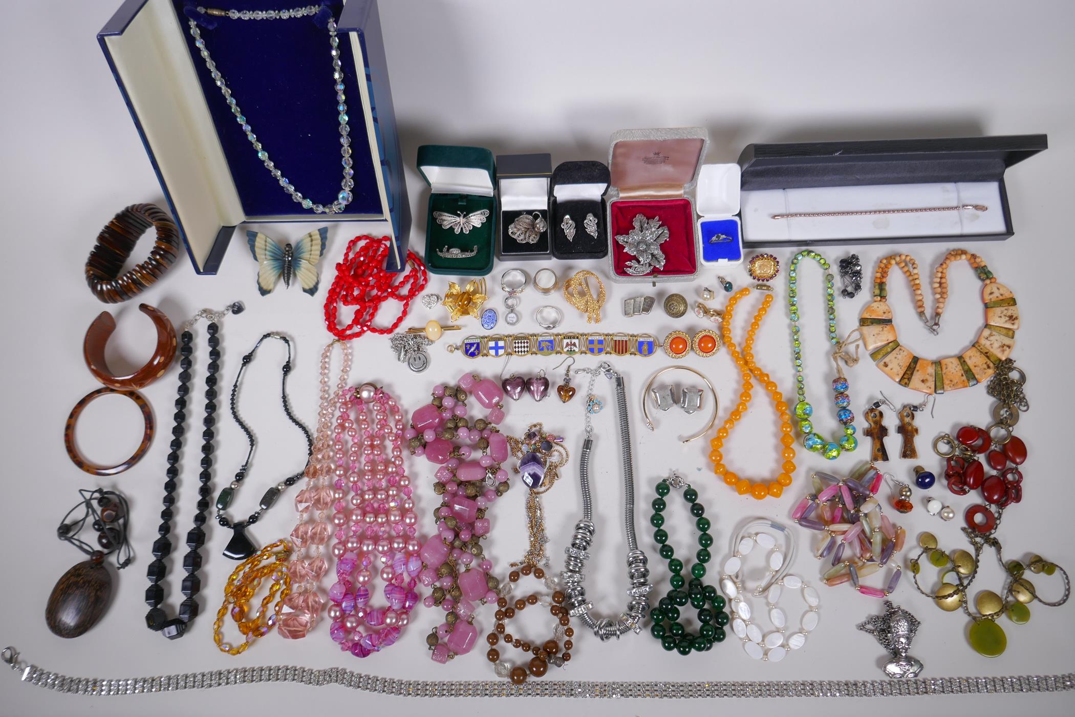 A collection of vintage costume jewellery including some silver jewellery, necklaces, rings etc