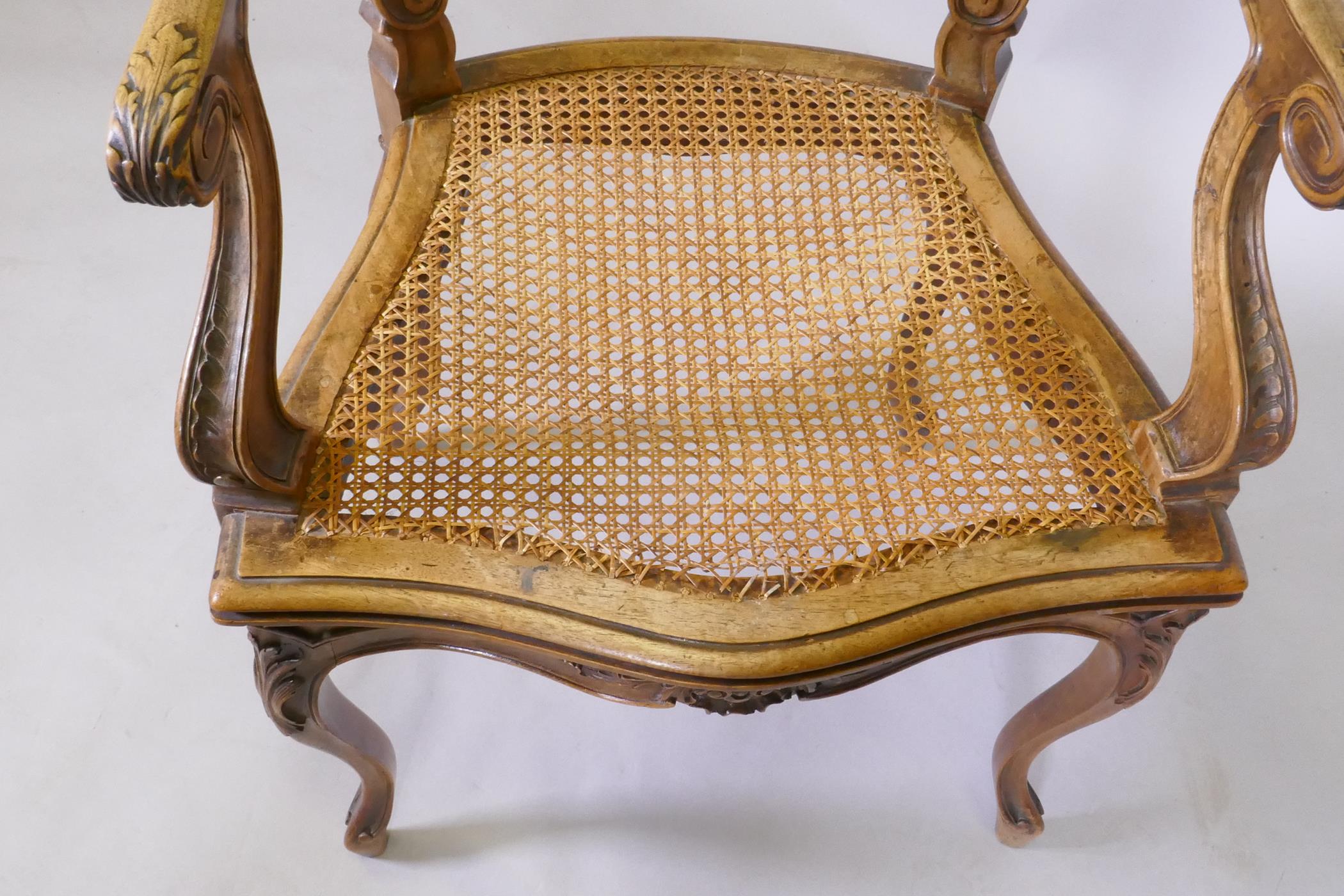 A C19th French carved walnut open arm chair with caned seat - Image 3 of 5