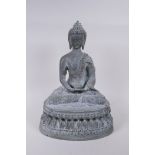 A Tibetan cast bronze Buddha with a vert de gris patina, 35cm high