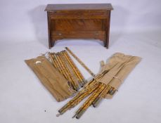 An officer's military campaign bed with concertina action, 25 x 809 x 52cm, and two sets of bamboo