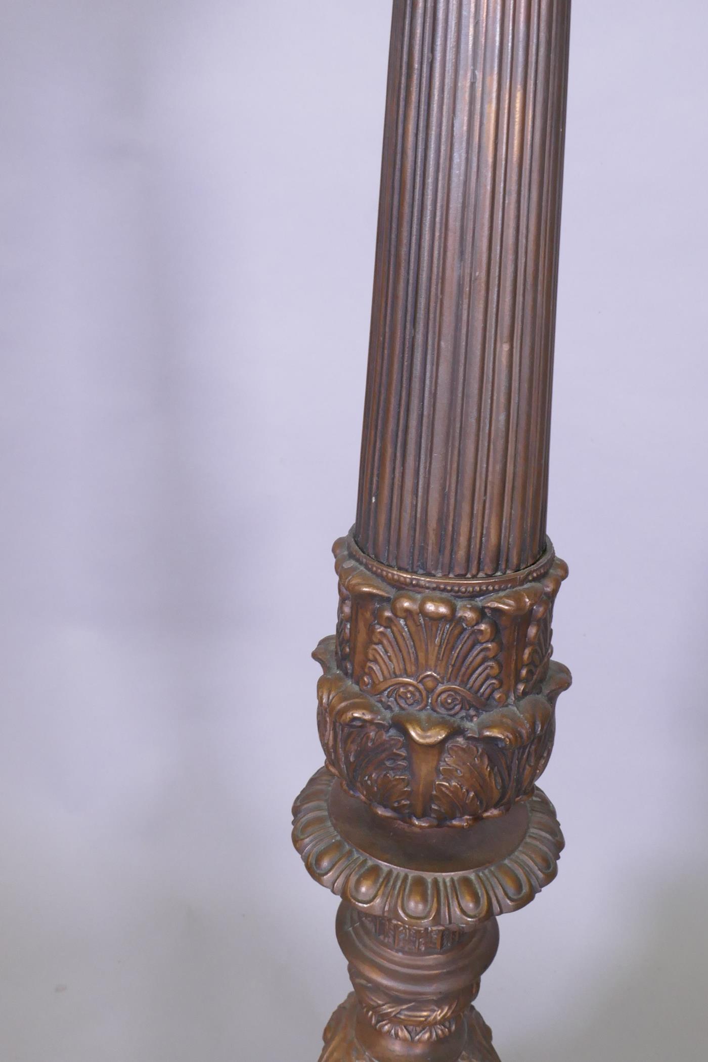 A copper and bronzed metal floor lamp with fluted column and Renaissance Revival style decoration, - Image 4 of 4