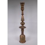 A middle eastern copper and brass hookah pipe with repousse floral decoration, 72cm high
